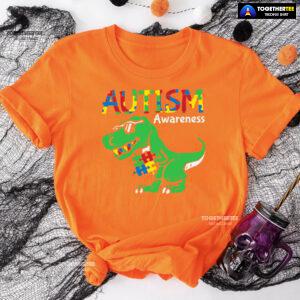 Autism Awareness Dinosaur Puzzle Pieces T-Shirt - Women's Tee