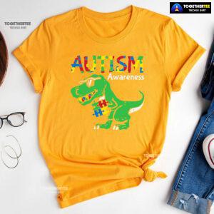 Autism Awareness Dinosaur Puzzle Pieces T-Shirt - Women's Tee