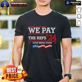 Alt Text: Official Kansas City We Pay The Refs 24 Stop Being Poor T-Shirt, featuring bold graphic and vibrant colors.
