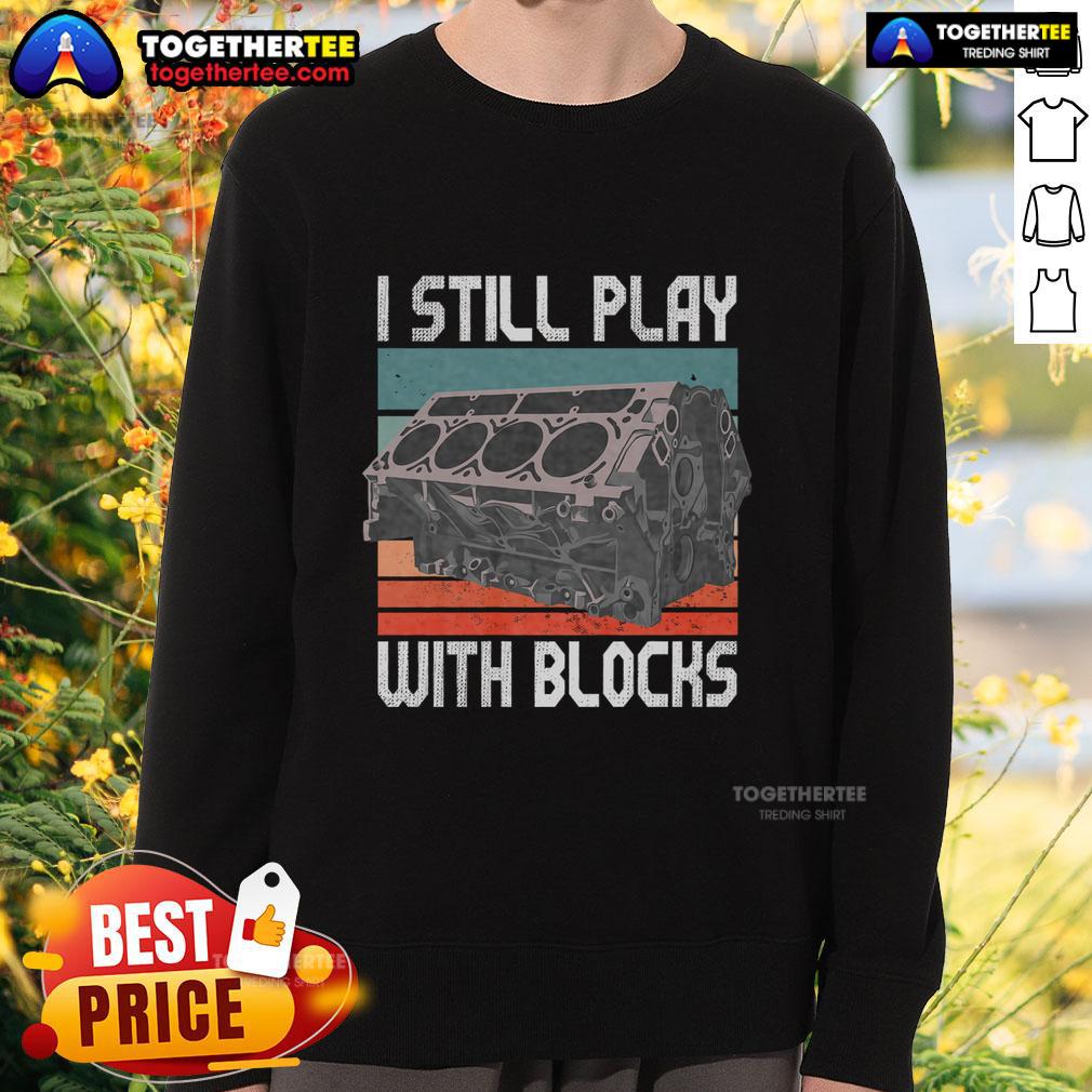 Vintage sweatshirt featuring 'I Still Play With Blocks' design for maintenance mechanics, perfect for motor engine enthusiasts.