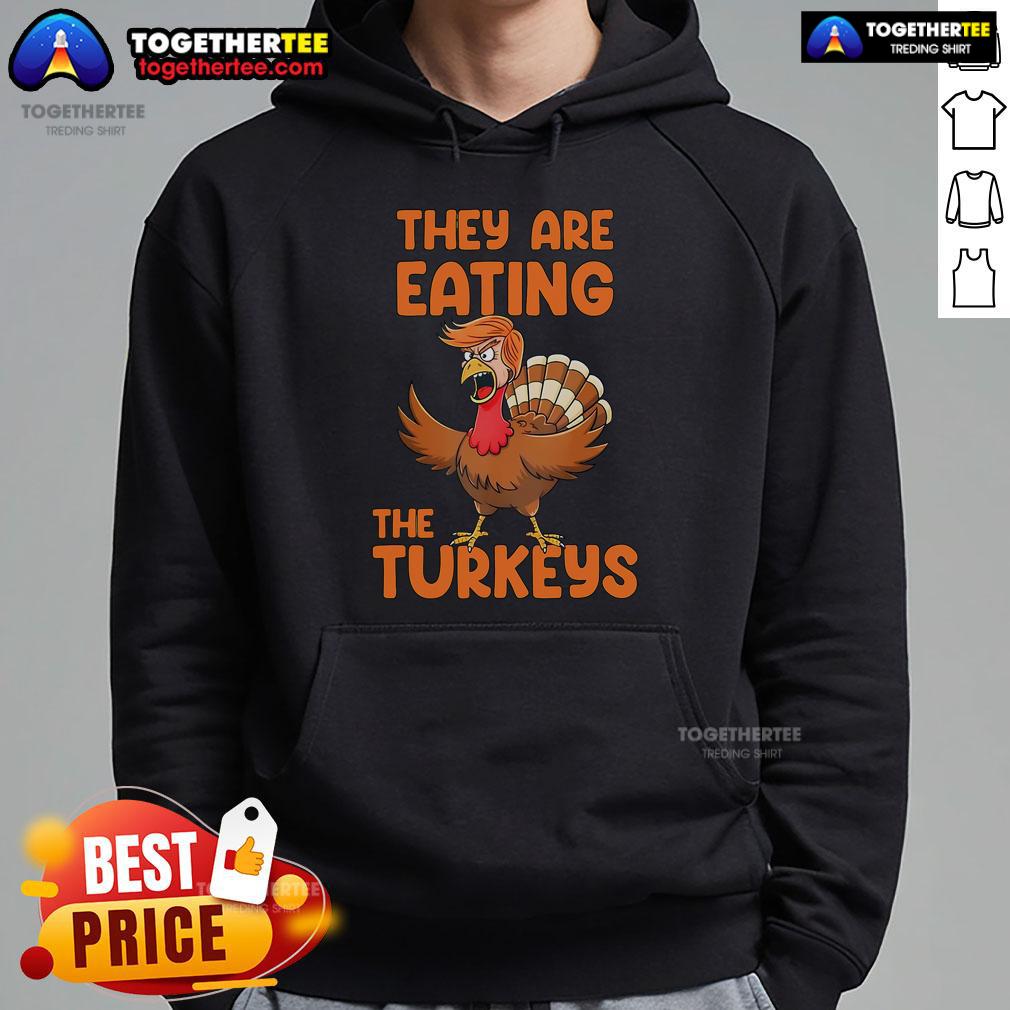 Premium Thanksgiving hoodie featuring Trump with turkeys, perfect for festive holiday celebrations and turkey lovers.