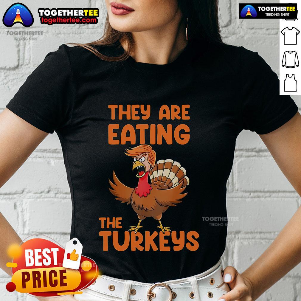 Premium 'They Are Eating The Turkeys' Thanksgiving Trump Turkey Ladies Tee featuring a humorous turkey graphic.