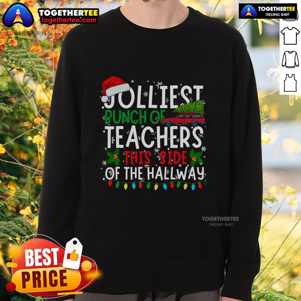 Top Jolliest Bunch of Teachers This Side of the Hallway Christmas sweatshirt worn by cheerful educators in a festive setting.