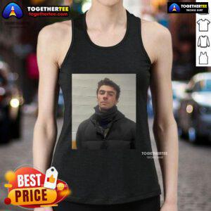 Official Luigi Mangione mugshot image featured on a tank top design, showcasing a bold graphic style.