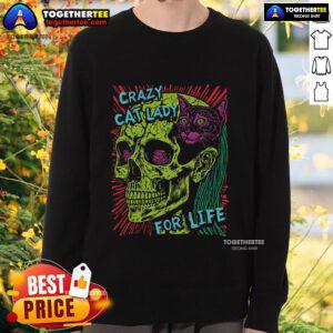 Crazy cat lady in a goth punk style, wearing a skull sweatshirt, cuddling a grunge cat, showcasing unique fashion.
