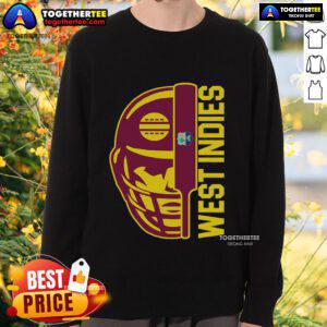 Alt Text: Top Cricket West Indies fan wearing a sweatshirt, holding a helmet, ball, and bat, showcasing team spirit.