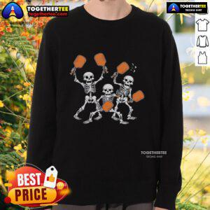 Top Spooky Skeletons Pickleball Halloween Smash Sweatshirt featuring playful skeletons playing pickleball in a festive design.
