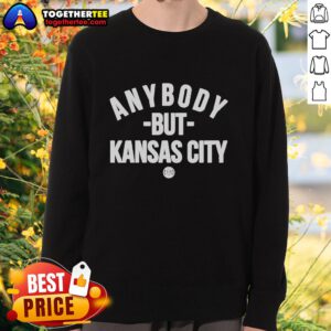 Cozy 'Hot Anybody But Kansas City' sweatshirt displayed on a wooden table, perfect for sports fans and casual wear.