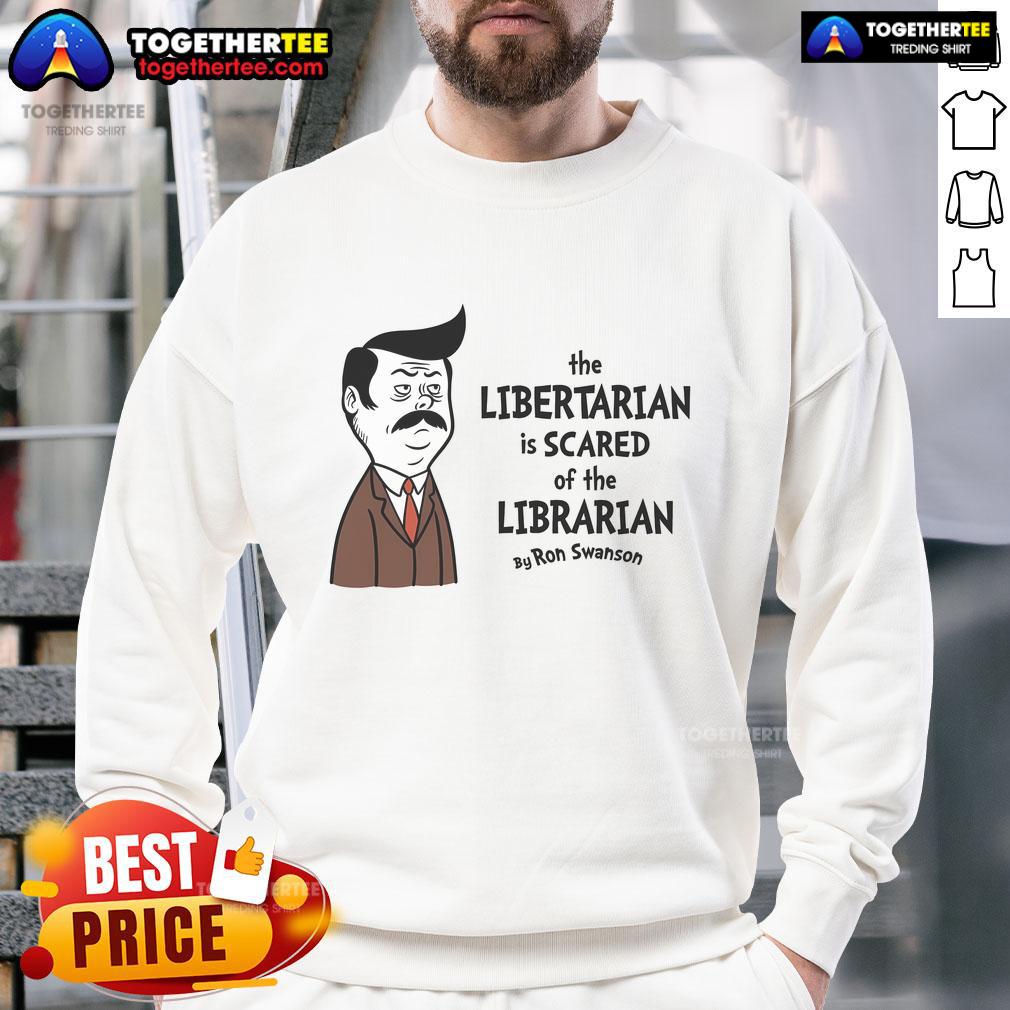 Official Ron Swanson sweatshirt featuring 'The Libertarian Is Scared of The Libertarian' design for fans of humor and liberty.