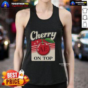 Stylish cherry on top tank top worn by a pretty armchair expert, showcasing a trendy casual look.