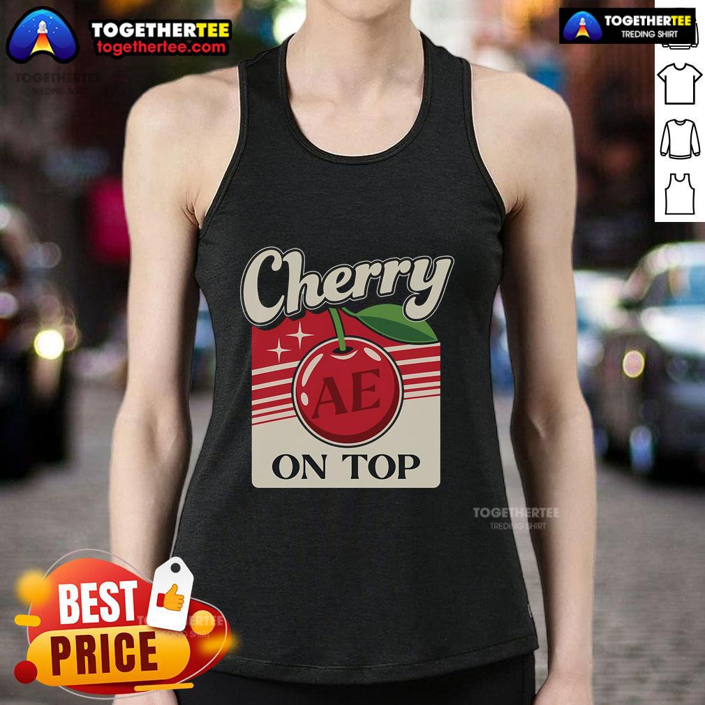 Stylish cherry on top tank top worn by a pretty armchair expert, showcasing a trendy casual look.