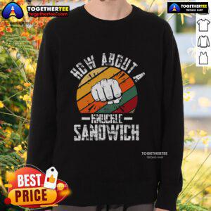 Boxing trainer in 'How About A Knuckle Sandwich' sweatshirt, showcasing passion for boxing and coaching skills.