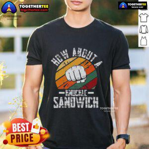 Boxing trainer wearing 'How About A Knuckle Sandwich' T-shirt, showcasing passion for boxing and coaching style.