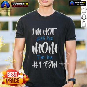 Alt Text: Top I'm Not Just His Mom I'm His Number One Fan T-Shirt design featuring bold text and a stylish graphic.