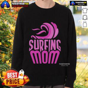Top Surfing Mom wearing a sweatshirt with surfer sayings, showcasing her passion for surfing and motherhood.
