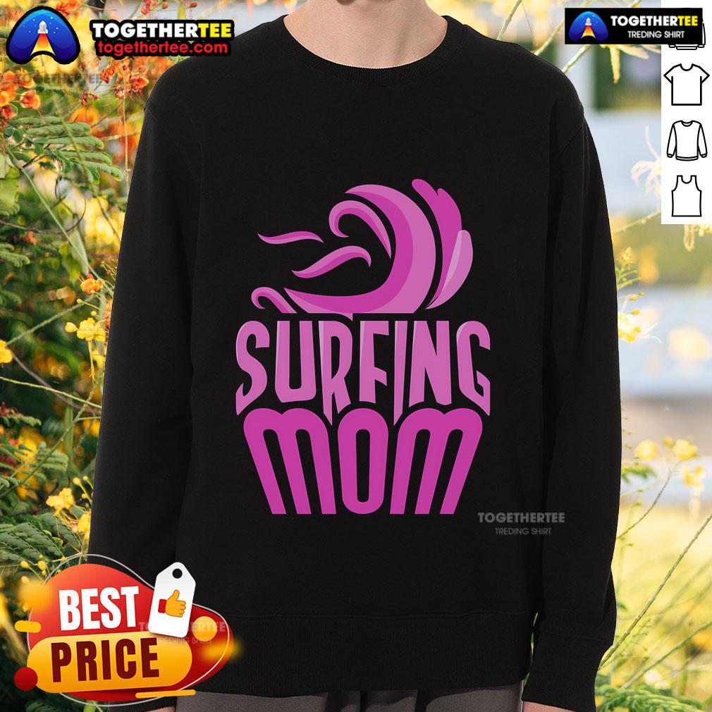 Top Surfing Mom wearing a sweatshirt with surfer sayings, showcasing her passion for surfing and motherhood.