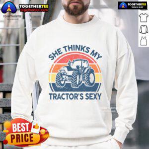 Alt Text: Vintage farmer sweatshirt featuring the phrase Funny, She Thinks My Tractor's Sexy in bold lettering.