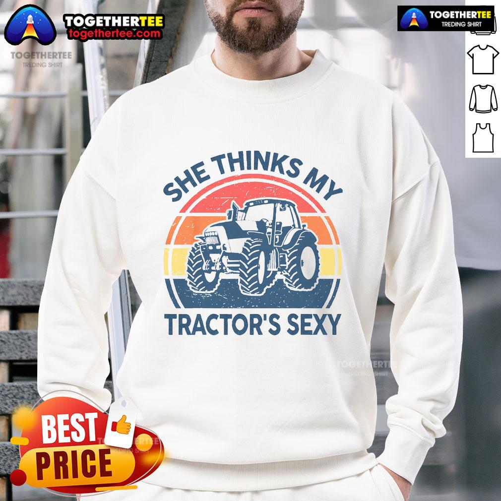 Alt Text: Vintage farmer sweatshirt featuring the phrase Funny, She Thinks My Tractor's Sexy in bold lettering.