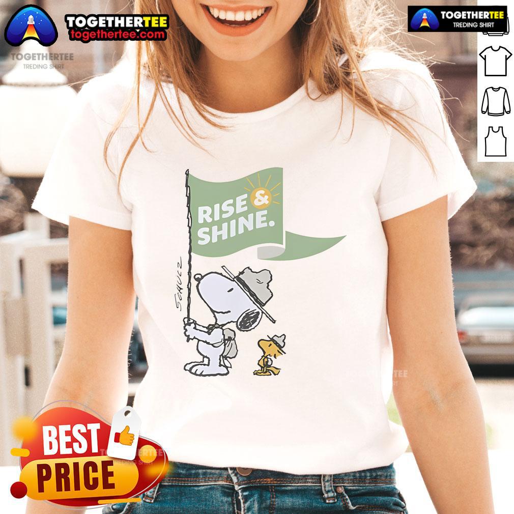 Alt Text: Official Snoopy and Woodstock Rise Shine Flag Ladies Tee featuring vibrant graphics and soft fabric for comfort.