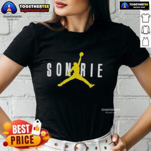 Alt Text: Top J Balvin Sonrie X Jordan ladies tee featuring vibrant colors and stylish design for trendy women's fashion.