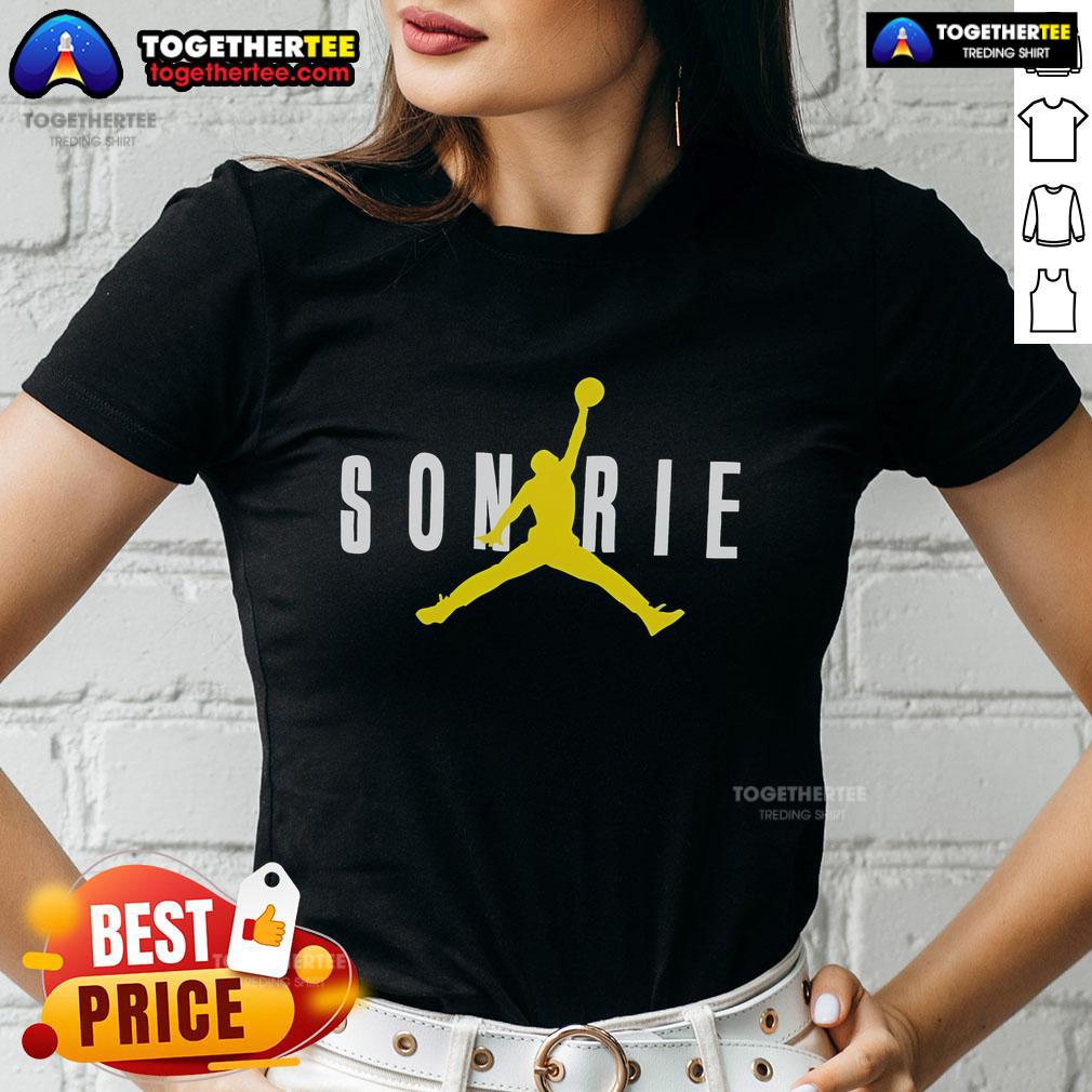 Alt Text: Top J Balvin Sonrie X Jordan ladies tee featuring vibrant colors and stylish design for trendy women's fashion.