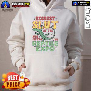 Person wearing a 'Nice Biggest Slut' hoodie at the Reptile Expo, showcasing unique fashion and reptile-themed merchandise.