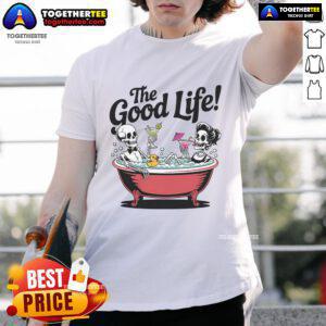 Alt Text: Skeletons relaxing in a bathtub with drinks, showcasing 'Nice Living The Good Life' vacation T-shirt design.