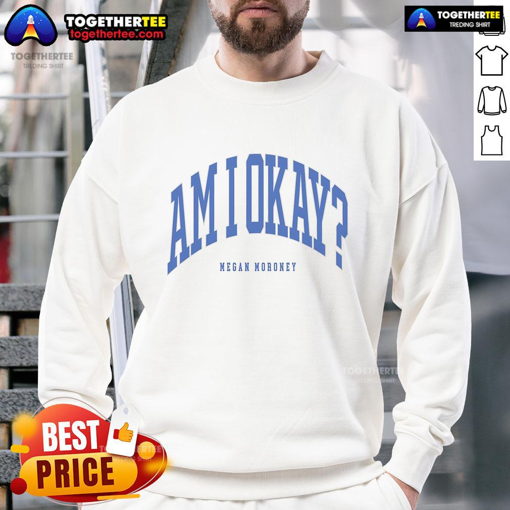 Alt Text: Megan Moroney wearing a stylish 'Am I OK' sweatshirt, showcasing trendy fashion and vibrant colors.