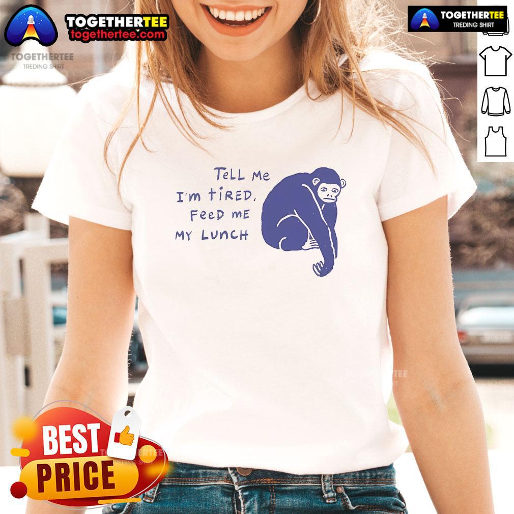Charming chimpanzee wearing a 'Tell Me I'm Tired, Feed Me My Lunch' tee, showcasing a playful and tired vibe.
