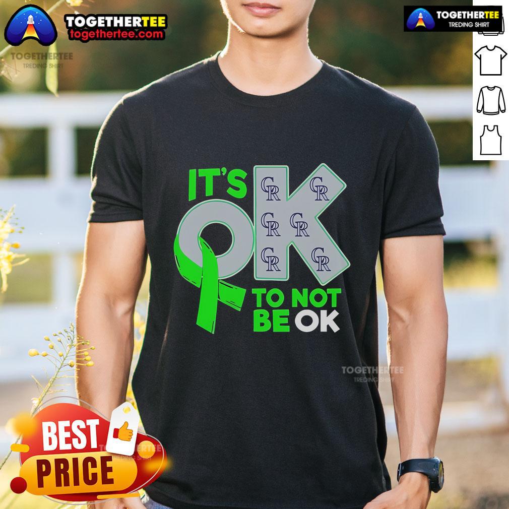Alt Text: Official Colorado Rockies It's Ok To Not Be Ok T-Shirt featuring team colors and logo, promoting mental health awareness.