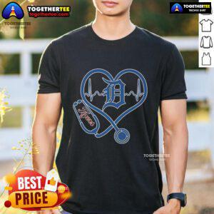 Official Detroit Tigers Caring Hearts Nurses T-Shirt featuring team logo and heart design, perfect for dedicated healthcare supporters.