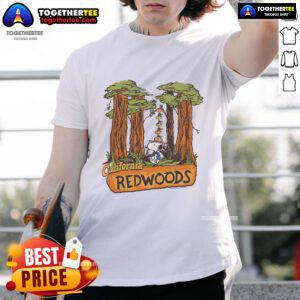 Official Peanuts Snoopy X California Redwoods T-Shirt featuring iconic Snoopy design among lush redwood trees.