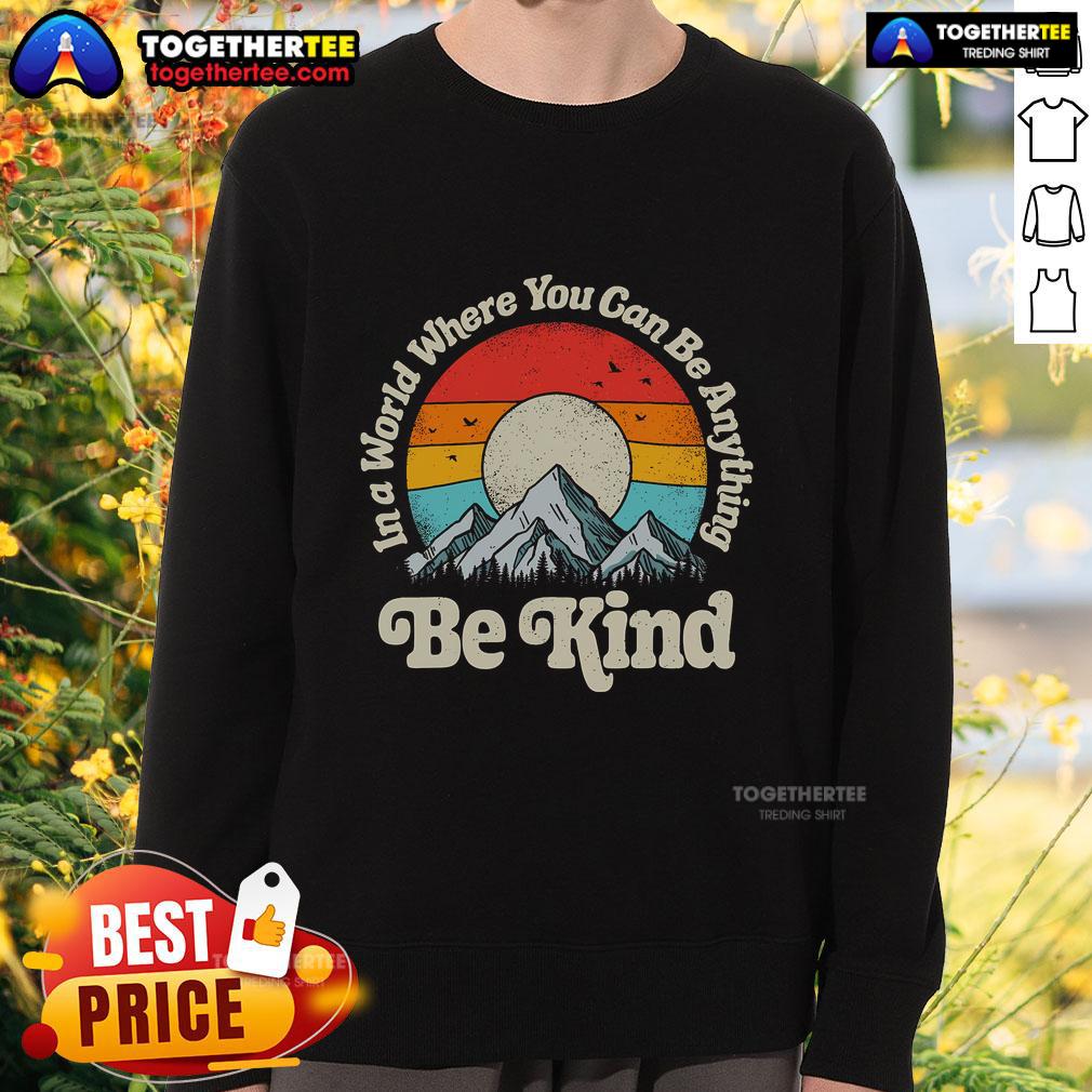 Premium 'Be Kind' sweatshirt with retro sunset design, promoting kindness in a stylish and comfortable way.