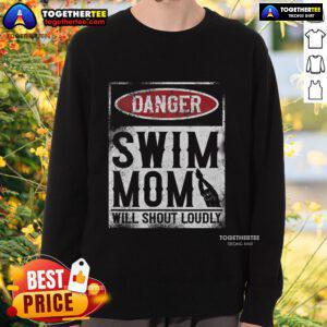 Mom wearing a 'Top Danger Swim' sweatshirt, shouting loudly at a swim meet, showcasing her support and enthusiasm.