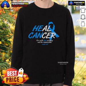 Blue ribbon sweatshirt promoting cancer awareness with the message 'Top He Can Heal Cancer' for supportive advocacy.