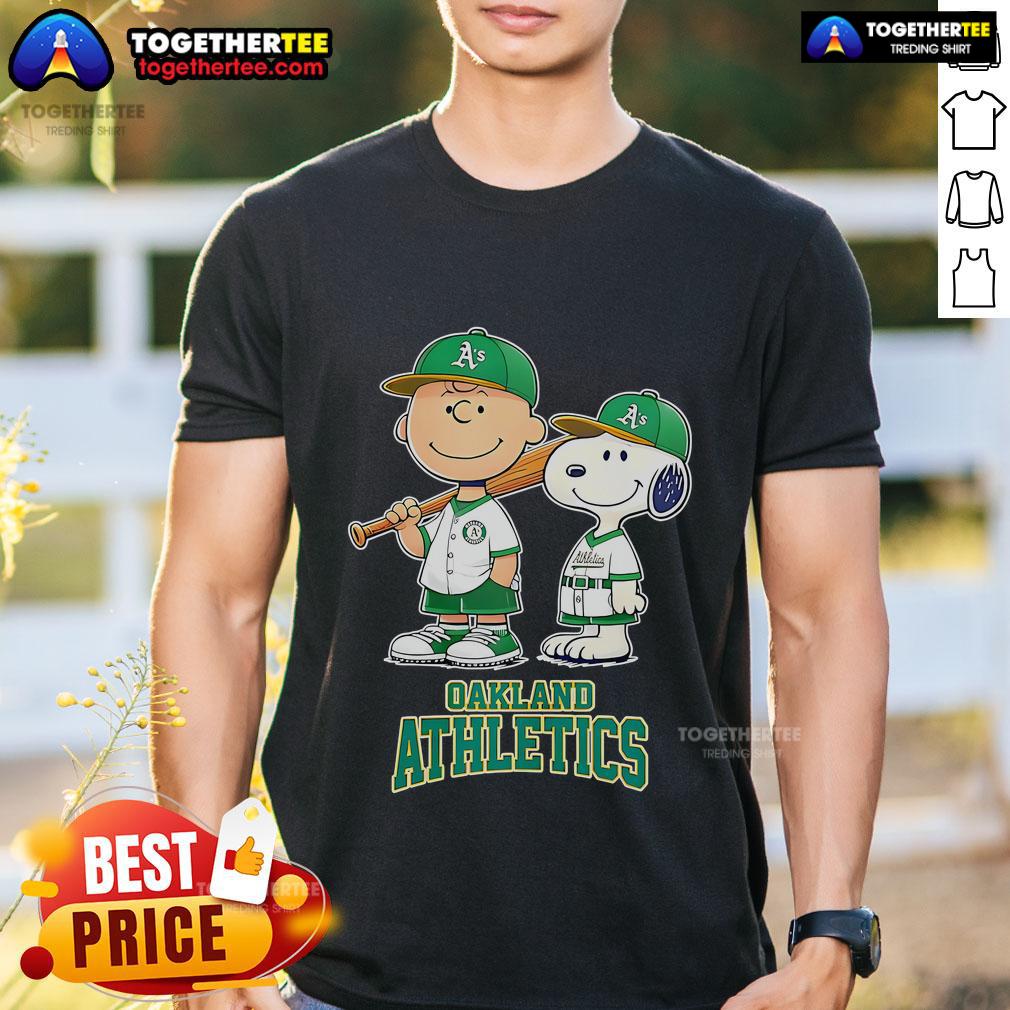 Alt Text: Top Oakland Athletics Charlie Brown and Snoopy baseball cartoon fan T-shirt featuring iconic characters in team colors.
