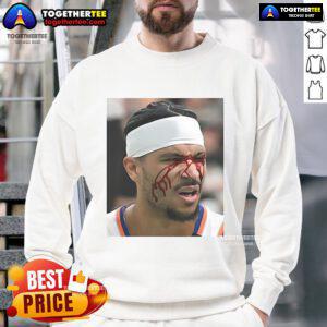 Josh Hart takes an elbow to the face in a stylish sweatshirt, showcasing his resilience on the basketball court.