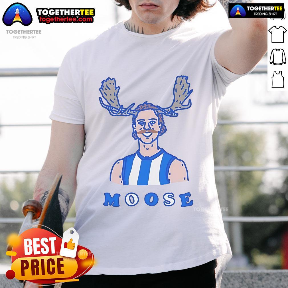 Official Moosebar Tcd T-Shirt displayed on a wooden background, showcasing its unique design and vibrant colors.