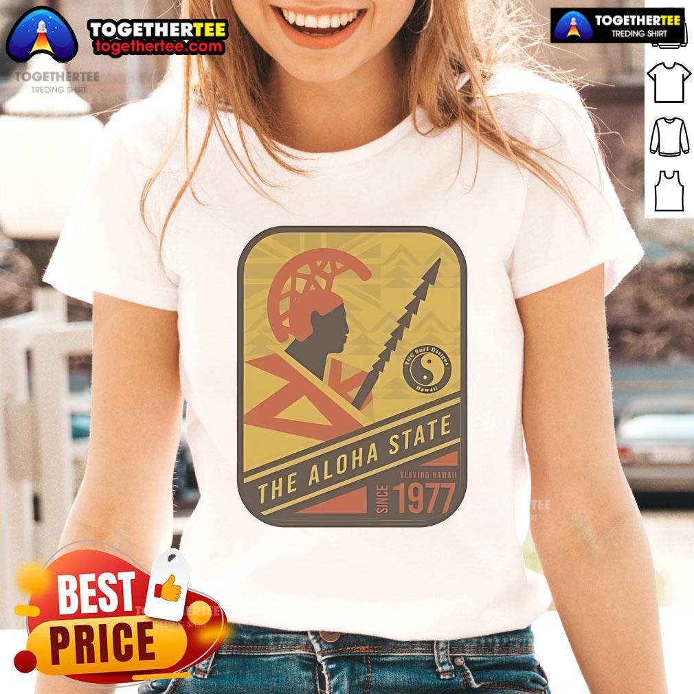 Alt Text: Official Aloha State Stamp Warrior Ladies Tee, celebrating Hawaii since 1977 with vibrant design and comfortable fit.