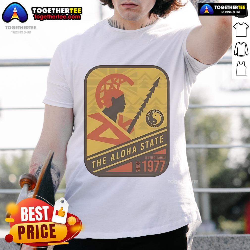 Alt Text: Official The Aloha State Stamp Warrior T-Shirt, serving Hawaii since 1977, showcasing vibrant island pride and culture.