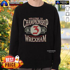 Alt Text: Wrexham AFC Welcome to Championship sweatshirt featuring club colors and logo, perfect for fans celebrating promotion.