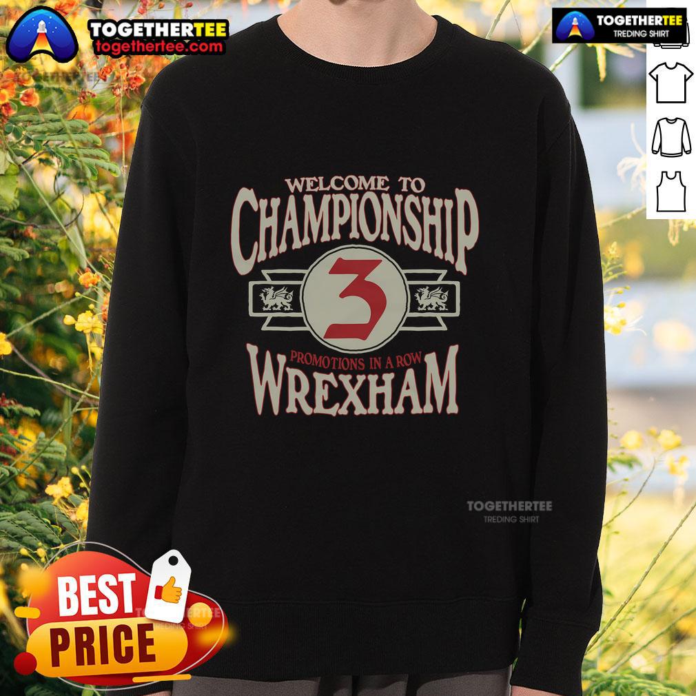 Alt Text: Wrexham AFC Welcome to Championship sweatshirt featuring club colors and logo, perfect for fans celebrating promotion.