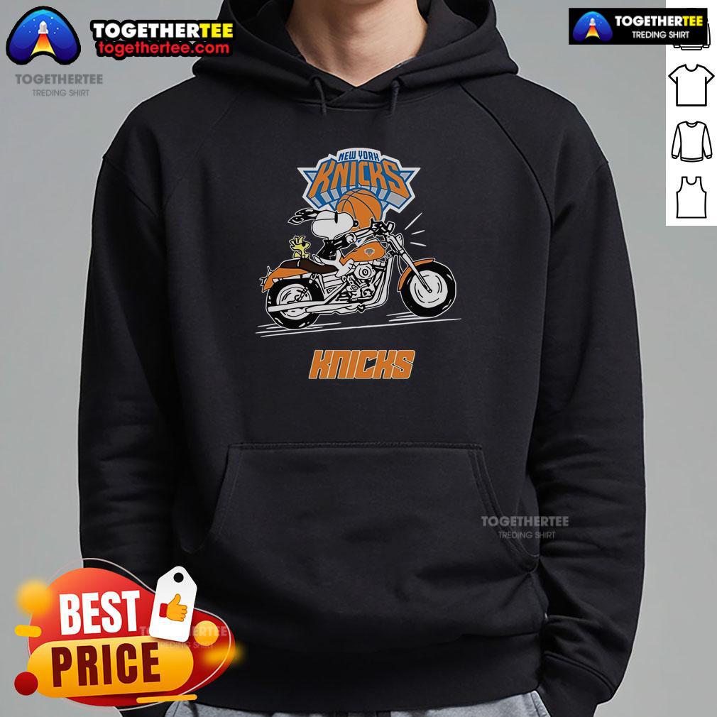 Alt Text: Snoopy and Woodstock riding a motorbike in a New York Knicks hoodie, showcasing playful cartoon character style.