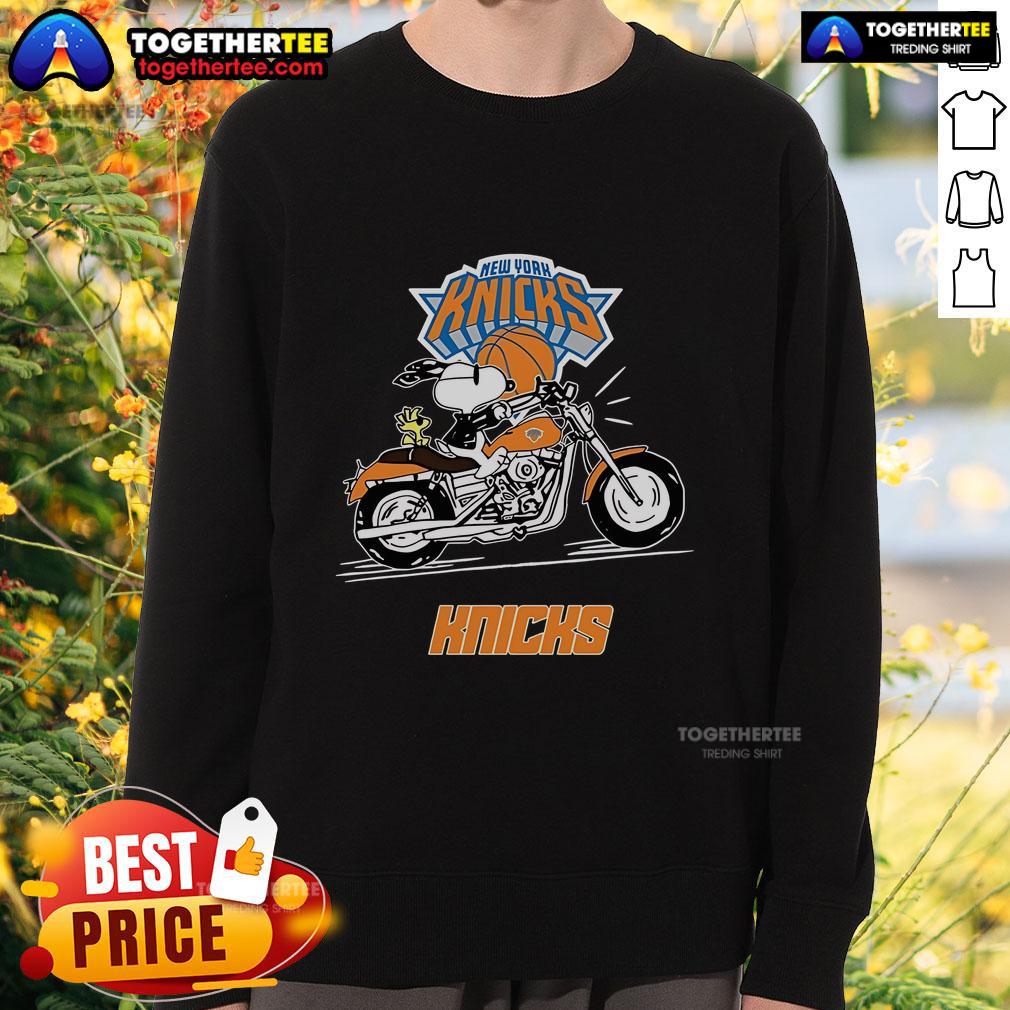 Alt Text: Snoopy and Woodstock driving a motorbike on a New York Knicks sweatshirt, showcasing a fun and vibrant design.