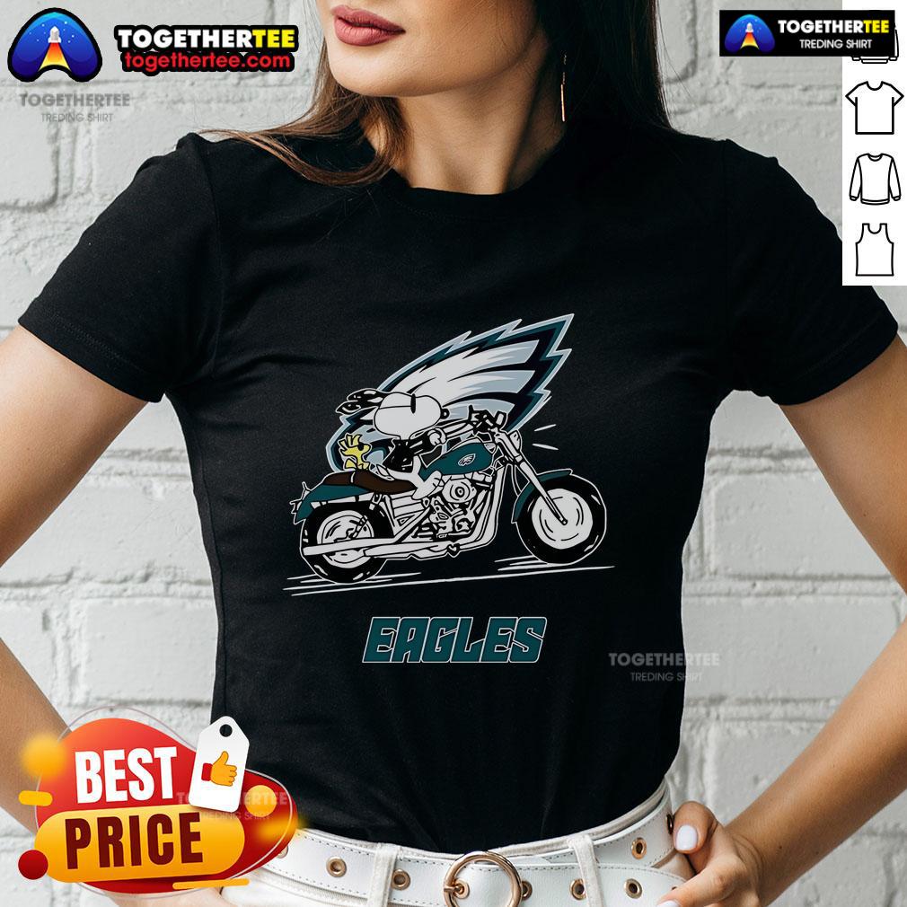 Original Snoopy and Woodstock riding a motorbike on a Philadelphia Eagles ladies tee, perfect for fans and collectors.