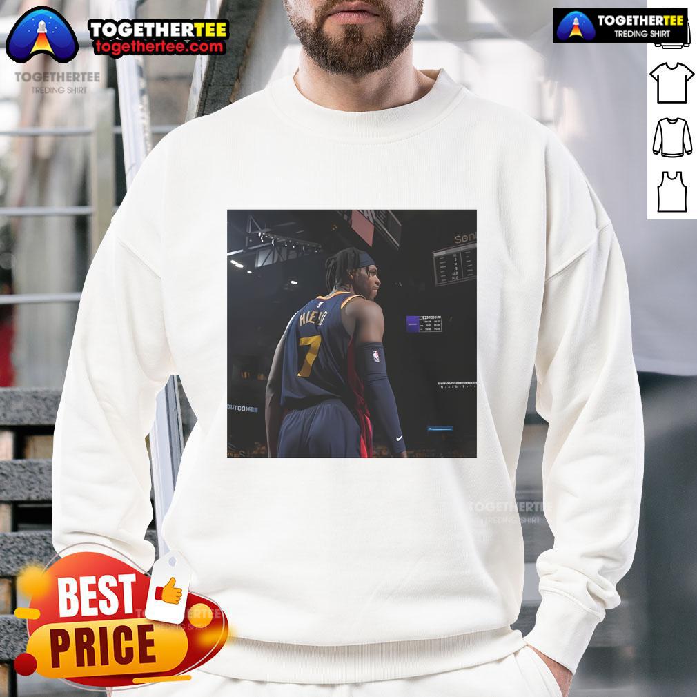 Buddy Hield in Original Warriors sweatshirt, showcasing unique style and team spirit on the basketball court.