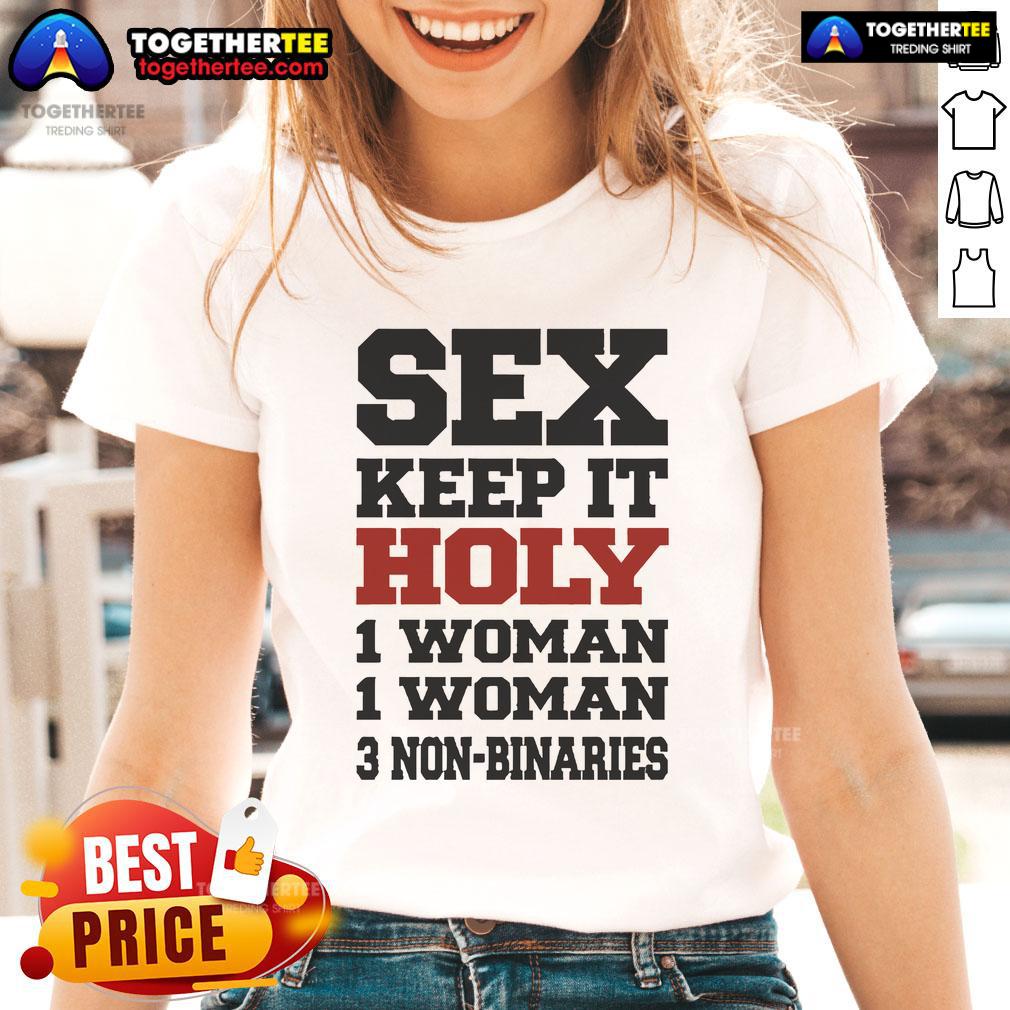 Hot Rebecca Black wearing a 'Keep It Holy' tee, surrounded by women and non-binaries, showcasing inclusive fashion.