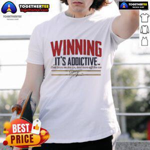 Official Matthew Tkachuk Winning It's Addictive Signature T-Shirt featuring Tkachuk's logo and vibrant design.