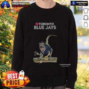 Alt Text: Official Toronto Blue Jays Tiny Turnip Velociraptor Sweatshirt featuring vibrant design and team colors. Perfect for fans!