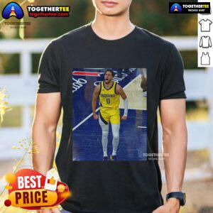 Alt Text: Official Tyrese Haliburton Indiana Pacers Game Frames T-Shirt showcasing vibrant team colors and player graphics.